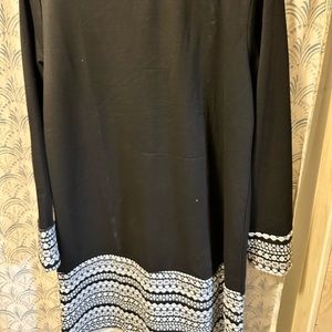 Tried on once. Approximately 35 inches long. Fits more like an X-Large